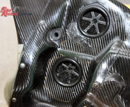 The carbon-fibre airbox is mounted to the side of the bike.