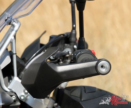 The missing bolt from the handguard must have vibrated out. In general vibrations aren't noticed unless you're cruising (or fanging) at high rpm.