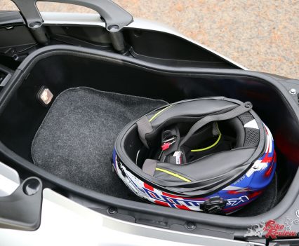 Plenty of room to spare with a full face in the TMax SX's underseat storage