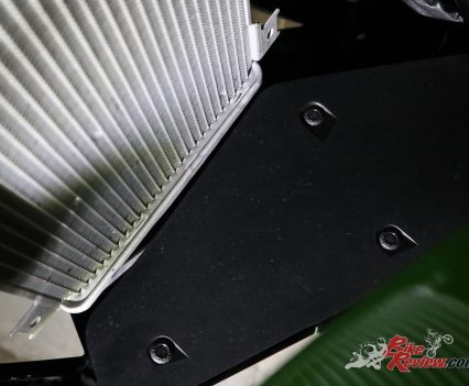 Also do the inner fairing at the same time, this is inside the fairings at the rear of the front wheel, there's four pull pins here to remove