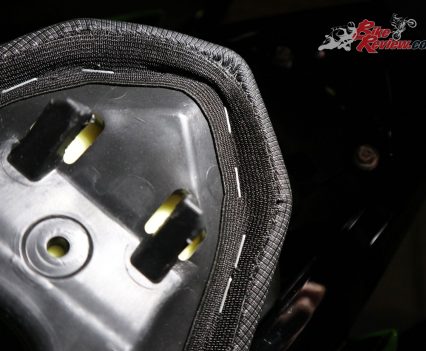 The pillion seat locks in place at the rear, with a locking mechanism at the front, once released pull towards the front of the bike