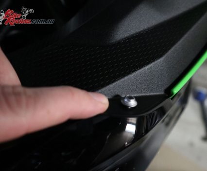 The extra bolt up here releases the whole fairing, so undo this too while you're in this area