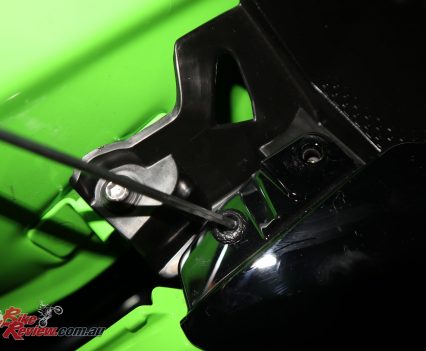 Push the centre in and you'll be able to get a nail under the edge and remove the pull pin