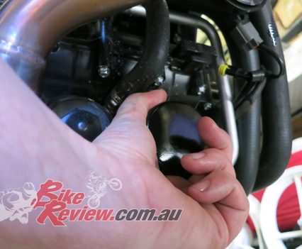 A new OEM part oil filter was screwed on and hand tightened.