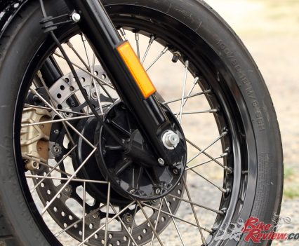 Old wire-spoked wheels.