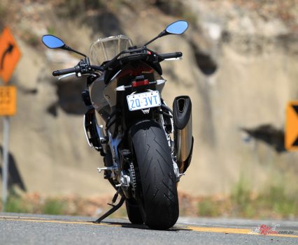 A 190-section rear tyre versus the Factory 200, more pillion room and a taller screen.