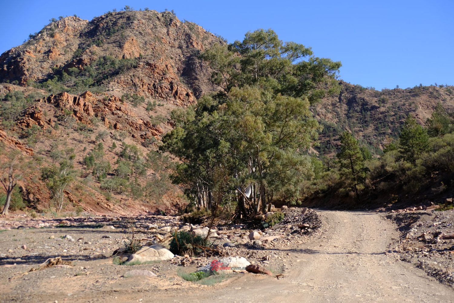 Creek beds are usually dry, and if they flood and destroy the tracks, these are graded again quite quickly.
