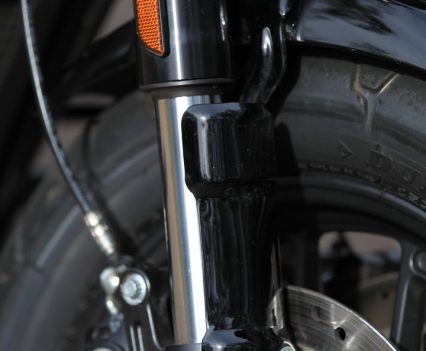 Single cartridge 43mm inverted with aluminium fork triple clamps; triple rate spring.