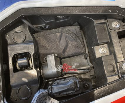 Tiny bit of storage under the pillion seat area.