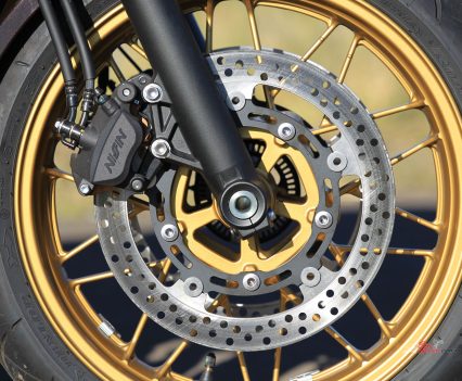 Dual-piston Nissin calipers with 300mm discs.