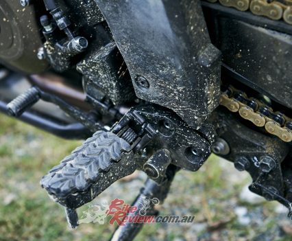 Footpegs with removable rubber inserts.