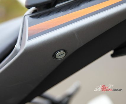 Lockable pillion seat to access the tool kit.