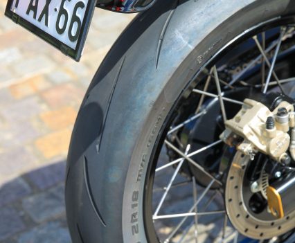 Metzeler oversized race tyre and Excel anodised alloy rim.