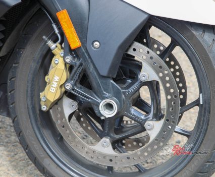 Dual 320mm discs with four-piston calipers.