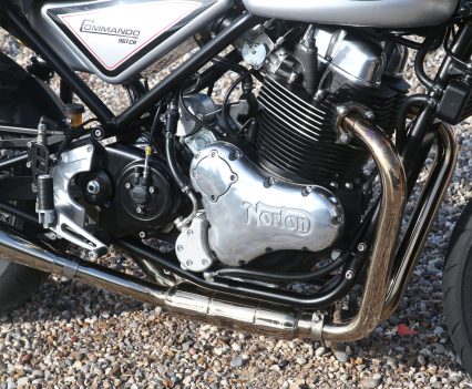 OHV 961cc dry sump parallel-twin motor with two valves per cylinder.