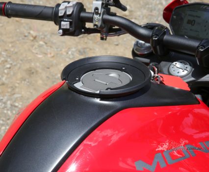 Plastic through the centre of the tank.