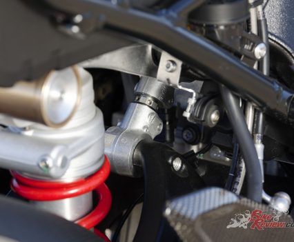 Aluminium underslung double-sided swingarm with central spring strut, spring preload, adjustable compression and rebound.