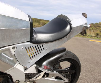 Twin Keihin FCR 35mm carburetors hidden in here.