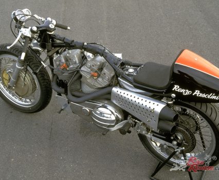 Tubular steel single-loop backbone with triangulated subframe and duplex engine cradle.