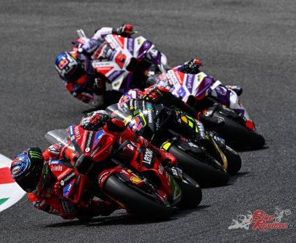 The pack began to shuffle as the rain came down on the far section of the circuit with nine laps to go.