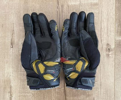 Fabric for flex, leather for protection and velcro wrist strap.