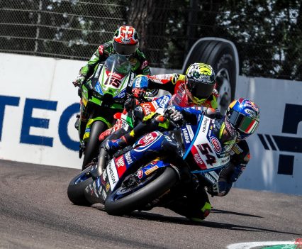 Toprak Razgatlioglu denied Axel Bassani an emotional maiden victory but gained 25 points on Alvaro Bautista as the reigning Champion crashed out.