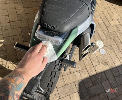 Fold the wipe in half and go over the bike.