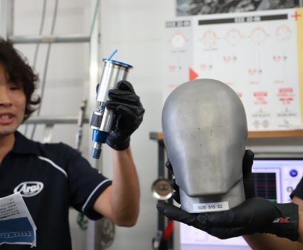 Helmets are placed in a mag-alloy mould with three-axis measurements.