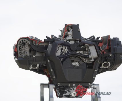 Air/liquid-cooled four-stroke flat twin engine with double overhead and chain driven camshafts (BMW ShiftCam) and balance gear wheels.