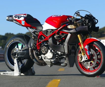 The large radiator, which featured an offset slot for the front cylinder to poke through, incorporated a triangular-shaped oil cooler in its lower section, as well as an air duct to the right of the cylinder head which fed cool air to the rear cylinder’s upper camdrive.