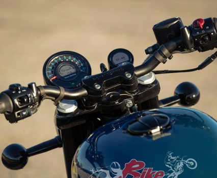 The top triple-clamp and fat 'bars look great.