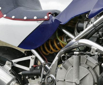 Fabricated box-section chrome-moly steel swingarm with fully-adjustable Öhlins cantilever monoshock.